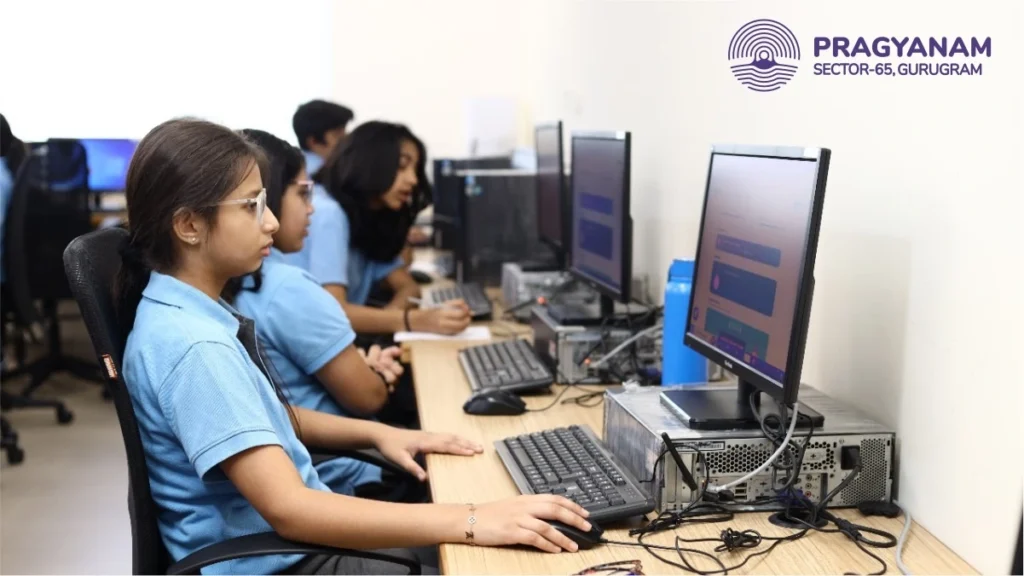 A student is sitting in front of a computer system, focused on the screen, engaged in online learning or completing a digital assignment